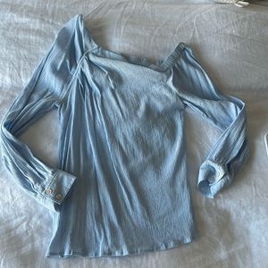 Beautiful Blouse with open shoulder. In great shape.